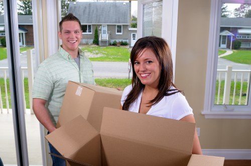 Loading household items into a van for a Paddington relocation