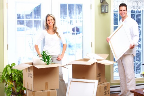 Packed moving boxes and furniture ready for transport in Paddington